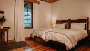 a bedroom with a large bed and a window at Oregon House in Riebeek-Wes +46 photos