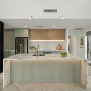 a kitchen with a large island in the middle at Mount Pisa View Stay - Barnd new holiday home in Cromwell