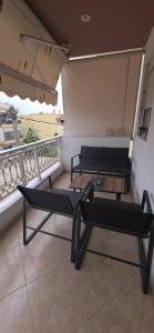 two beds on a balcony with a view at ARM OV Apartment in Alexandroupoli