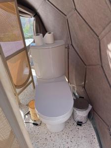 a bathroom with a toilet with three rolls of toilet paper at Dôme Nissaya in Nice +16 photos