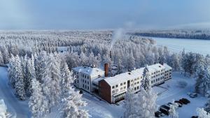 an aerial view of a building in the snow at Hotel Metsähirvas in Rovaniemi