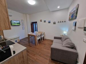 a living room with a couch and a table at Dimore Rosantò 2 in Palombaro