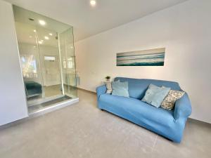 a blue couch sitting in a living room at Blue Oasis in Tacoronte +14 photos