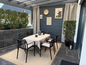 a table and chairs sitting on a patio at Sauerland Wellness Apartment mit Sauna und Jacuzzi in Olpe