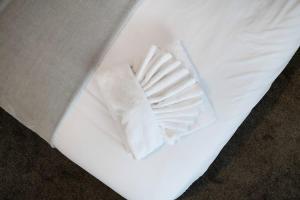 a white envelope with a folded napkin on it at NEW! 3BR in Haughton Road in Darlington