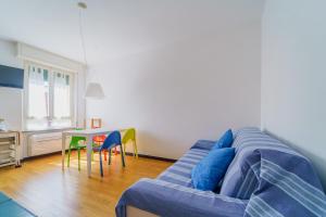 a living room with a couch and a table at Nestly house Portovenere in Portovenere
