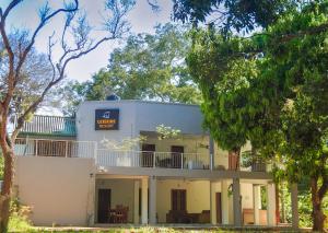 an old white building with a sign on it at Wilpattu Corridor Leisure in Wilpattu