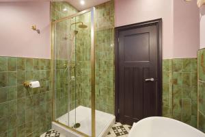 a bathroom with a shower with a toilet and a glass door at Chic Retreat with King Bed in Barnard Castle in Barnard Castle