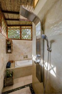 a bathroom with a shower with a sink and a tub at Uva Blue Villas - Zen Villa 1 - 3 Bedroom Villa, Private Garden & Yoga Deck in Puerto Viejo