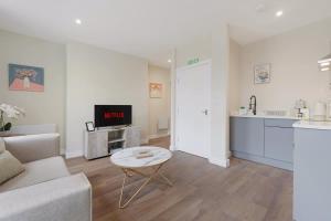 a living room with a couch and a table at Flat1 1BR in Horsemarket in Barnard Castle