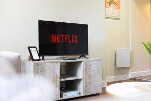 a television on a tv stand in a living room at Flat1 1BR in Horsemarket in Barnard Castle