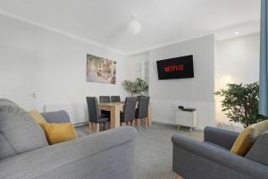 a living room with a table and chairs at New! 4BR in Durham Road in Annfield Plain