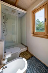 a bathroom with a toilet and a shower and a sink at Atessa Escapes in Atessa +24 photos