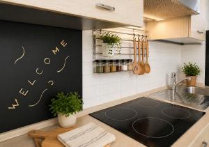 a kitchen with a sink and a counter top at Casa Giulio Collio Suite in Cormòns