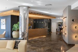 a lobby with a couch and a counter at Hotel SB Corona Tortosa in Tortosa +37 photos