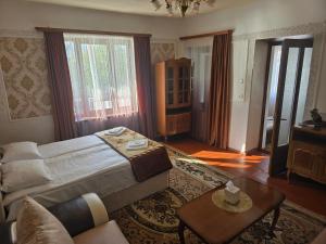 a bedroom with a bed and a living room at Sanahin Old&New in Alaverdi