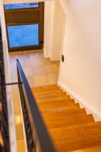 a staircase in a house with a window at Buttermarkt House ``Rooms at the Ring`` in Adenau
