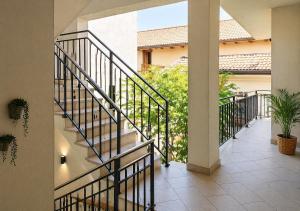 a balcony with a staircase in a house at Casa Giulio Collio Suite in Cormòns