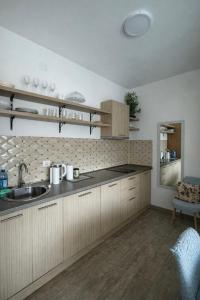 a kitchen with a sink and a counter top at Blue Bay Studio in Bečići
