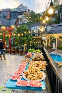 a row of plates of food on a table at Mây Trắng Homestay in Tam Ðảo