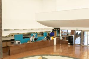 a lobby of a building with a reception desk at BLUESEA Costa Bastian in Costa Teguise