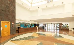 an empty lobby with a large room with a ceiling at BLUESEA Costa Bastian in Costa Teguise