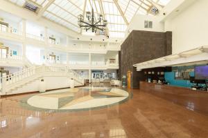 a large hall with a staircase in a building at BLUESEA Costa Bastian in Costa Teguise