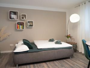 a bedroom with a bed and a table and chairs at Ferienwohnung Schwarzwald Lodge in Schömberg