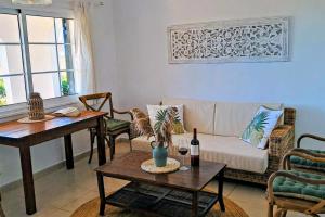 a living room with a couch and a table at Mar & Calma in Son Bou