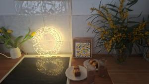a table with a plate of food and a plate of cake at Amira home suite in Sant Pere de Ribes