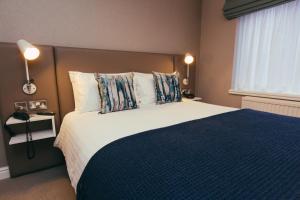 A bed or beds in a room at Peter Scott House Birmingham 