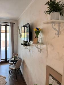a living room with a table and a wall with shelves at Dionis in Veliko Gradište