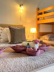 a bedroom with a bed with a doll on it at Dionis in Veliko Gradište