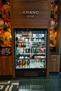 an amananoxnox refrigerator in a store with drinks at Hotel AMANO Grand Central in Berlin +133 photos