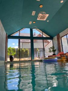 a swimming pool with a basketball hoop in a house at Casa Bucegi in Bran