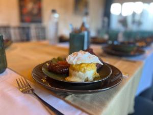 a plate of food on a table with a plate of food at Casa Bucegi in Bran