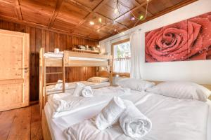 two bunk beds in a room with a painting on the wall at Appartement Walserstuba by A-Appartments in Brand