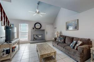 a living room with a couch and a fireplace at Leeward Cove B4 in Padre Island