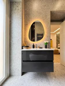 a bathroom with a sink and a mirror at Dimora Alfinito in Salerno +134 photos