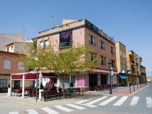a building on the corner of a city street at Rolix hc Hostal in Fuente-Álamo