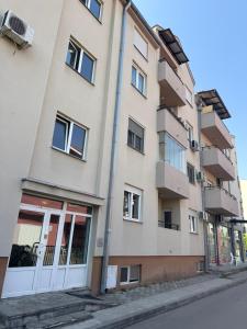 an apartment building on the side of a street at Apartman Filip2 in Kruševac