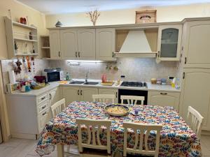 a kitchen with a table with a plate of food on it at Casa Etna Soul in Paterno +34 photos