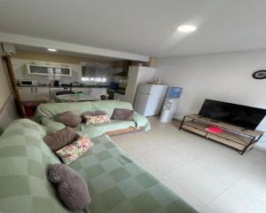 a living room with a couch and a tv at ÁTICO HOME y Garaje, Algemesi Home in Algemesí