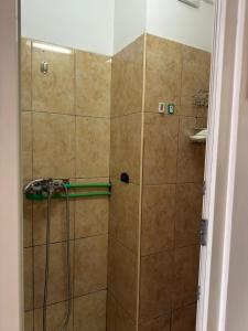 a shower with a glass door in a bathroom at ZipStay Inn in Cluj-Napoca +19 photos