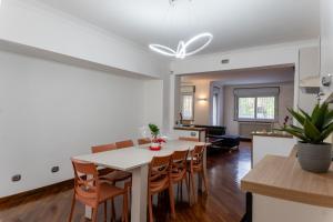 a kitchen and dining room with a table and chairs at La Mia Reggia B&B in San Nicola La Strada