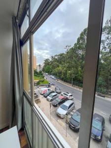 a view from a window of a parking lot at 2BR Estoril Apartment - Near Estoril Beach & Cascais - Sleeps 4 in Estoril