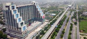 an aerial view of a large building and a street at Romaer's Room in Greater Noida
