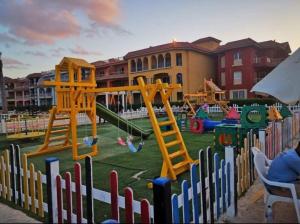 a playground with several play equipment in a yard at بورتو مطروح - القبطان in Marsa Matruh
