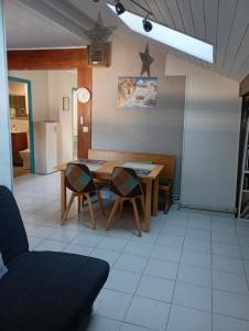 a dining room with a table and chairs at Zimmer mit Frühstück in Challes-les-Eaux