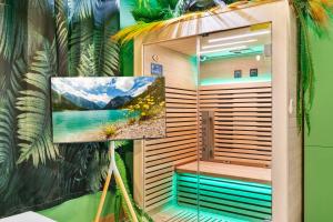 a sauna with a picture of a lake at YourSuite Studio Premium à Thème in Chaville